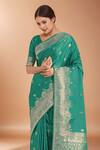 Samyukta Singhania_Turquoise Zari V-neck Woven Banarasi Saree With Blouse _Online_at_Aza_Fashions
