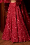 Istya_Red Net Sequins, Embroidery Plunge Neck Bridal Lehenga Set _Online_at_Aza_Fashions