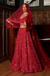 Buy_Istya_Red Net Sequins, Embroidery Plunge Neck Bridal Lehenga Set _at_Aza_Fashions