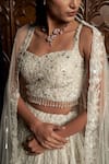 Istya_Off White Net Beads, Sequins, Crystals, Embroidery, Grey Embellished Lehenga Set _at_Aza_Fashions