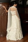 Shop_Istya_Ivory Net Sequins, Embroidery Embellished Fish Cut Lehenga Set _at_Aza_Fashions