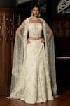 Buy_Istya_Ivory Net Sequins, Embroidery Embellished Fish Cut Lehenga Set _at_Aza_Fashions