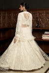 Shop_Istya_Ivory Net Sequins, Pearls, Beads, Embroidery Sweetheart Embellished Lehenga Set _at_Aza_Fashions