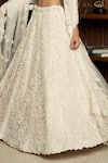 Shop_Istya_Ivory Net Sequins, Pearls, Beads, Embroidery Sweetheart Embellished Lehenga Set _Online_at_Aza_Fashions