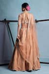 Shop_Muditaa By Urmila_Peach Dupion, Net Embroidery, Tassels, Crystals, Sequins V-neck Ira Lehenga Set _at_Aza_Fashions