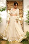Buy_Sanam_Ivory Chanderi Mirrors, Zari, Gota Patti V-neck Embroidered Lehenga Set _Online_at_Aza_Fashions