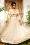 Shop_Sanam_Ivory Chanderi Mirrors, Zari, Gota Patti V-neck Embroidered Lehenga Set _at_Aza_Fashions