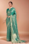 Buy_Samyukta Singhania_Turquoise Tassels, Zari V-neck Woven Banarasi Silk Saree With Blouse _at_Aza_Fashions