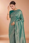 Samyukta Singhania_Teal Tassels, Zari Round Neck Woven Banarasi Silk Saree With Blouse _at_Aza_Fashions