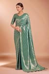 Buy_Samyukta Singhania_Turquoise Tassels V-neck Zari Woven Banarasi Saree With Blouse _at_Aza_Fashions