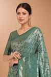 Shop_Samyukta Singhania_Turquoise Tassels V-neck Zari Woven Banarasi Saree With Blouse _Online_at_Aza_Fashions