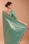 Samyukta Singhania_Turquoise Tassels V-neck Zari Woven Banarasi Saree With Blouse _at_Aza_Fashions