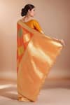 Shop_Samyukta Singhania_Orange Tassels V-neck Zari Woven Banarasi Silk Saree With Blouse _at_Aza_Fashions