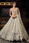 Buy Diyarajvvir Ivory Tulle Sequins, Beads, Embroidery V-neck Embellished Lehenga Set at Aza Fashions Buy_Diyarajvvir_Ivory Tulle Sequins, Beads, Embroidery V-neck Embellished Lehenga Set _at_Aza_Fashions