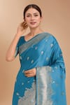 Samyukta Singhania Blue Satin, Silk Zari, Embroidery, Tassels Banarasi Woven Saree With Blouse at Aza Fashions Samyukta Singhania_Blue Satin, Silk Zari, Embroidery, Tassels Banarasi Woven Saree With Blouse _at_Aza_Fashions