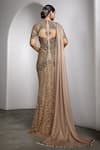 Shop Rocky Star Beige Net Beads, Sequins Round Neck Asymmetric Cut Out Embellished Gown at Aza Fashions Shop_Rocky Star_Beige Net Beads, Sequins Round Neck Asymmetric Cut Out Embellished Gown _at_Aza_Fashions