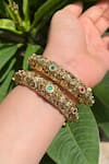 Prestones_Red Gemstones Temple Carved Bangles - Set Of 2 _Online_at_Aza_Fashions