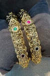 Prestones_Red Gemstones Temple Carved Bangles - Set Of 2 _at_Aza_Fashions