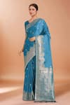 Buy Samyukta Singhania Blue Satin, Silk Zari, Embroidery, Tassels Banarasi Woven Saree With Blouse at Aza Fashions Buy_Samyukta Singhania_Blue Satin, Silk Zari, Embroidery, Tassels Banarasi Woven Saree With Blouse _at_Aza_Fashions
