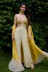 Shop_Nikasha_Cream Silk Beads, Sequins Halter Neck, Janeman Floral Print Jumpsuit With Cape _at_Aza_Fashions