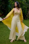 Buy_Nikasha_Cream Silk Beads, Sequins Halter Neck, Janeman Floral Print Jumpsuit With Cape _at_Aza_Fashions