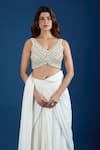 Samyukta Singhania_Ivory Chinon Embroidery, Mirrors V-neck Blouse With Pre-draped Saree _at_Aza_Fashions