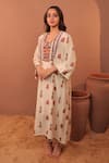Shop_Surkh Syahi_Off White Muslin Mirrors, Tassels, Beads V-neck Albeli Long Kaftan _at_Aza_Fashions
