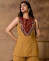 Isha Gupta Tayal_Mustard Gold Peplum Top & Pant Set _at_Aza_Fashions