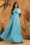 B'Infinite_Cyan Blue Twist Front Off Shoulder Gown _at_Aza_Fashions
