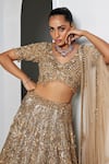 Buy_Opus Atelier_Gold Net, Satin, Tulle Embroidery, Sequins, Beads V-neck Ciara Lehenga Set _Online_at_Aza_Fashions