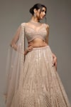 Shop_Opus Atelier_Beige Tulle, Net Embroidery, Zari, Sequins, Beads V-neck Kristen Lehenga Set _Online_at_Aza_Fashions