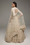 Shop_Opus Atelier_Beige Net, Tulle Embroidery, Sequins V-neck Marisol Lehenga Set _at_Aza_Fashions