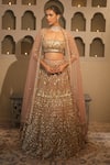 Shop_Libas Cafe by Nidhi & Ashish_Peach Net Zari, Sequins, Embroidery Square Neck Hand Lehenga Set _at_Aza_Fashions