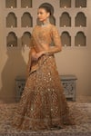 Shop_Libas Cafe by Nidhi & Ashish_Gold Net Embroidery, Sequins, Zari Scoop Neck Hand Lehenga Set _at_Aza_Fashions