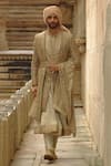 Buy_Nitika Gujral_Olive Green Silk, Chanderi Embroidery, Metallic Flower Butti Work Sherwani Set _at_Aza_Fashions