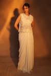 Ashutosh Joshi_Ivory Net, Crepe Embroidery, Pearls, Cut Work, Beads, Abstract Top And Skirt Set _at_Aza_Fashions