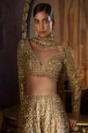 Seema Gujral_Gold Net Crystals, Beads, Sequins, Embroidery, Tassels Tonal Slit Skirt Set _at_Aza_Fashions