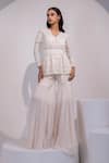 Buy_Yoseba_Ivory Net, Organza Embroidery V-neck Lace Embellished Peplum Top With Sharara _at_Aza_Fashions