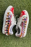 Buy_Modanta Footwear_Red Mirror And Cowrie Shell Embellished Sneakers _Online_at_Aza_Fashions