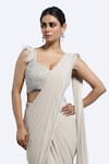 Shop_Onaya_Ivory Lycra, Net Feathers, Beads, Cutdana Work Blouse And Pre-draped Saree Set _Online_at_Aza_Fashions