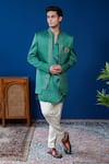 Shop_Philocaly_Emerald Green Linen, Satin Embroidery, Brooches Vishruta Shawl Lapel Bandhgala _at_Aza_Fashions