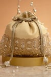 Amyra_Cream Cut Work, Pearls, Tassels, Embroidery Geet Brocade Embellished Potli - _at_Aza_Fashions