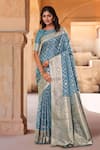 Buy Naintara Bajaj Blue Brocade, Silk Zari Boat Neck Floret Woven Saree With Blouse at Aza Fashions Buy_Naintara Bajaj_Blue Brocade, Silk Zari Boat Neck Floret Woven Saree With Blouse _at_Aza_Fashions