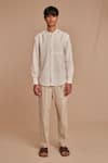 Saphed_Off White Linen Undyed Pleated Tappered Pant _Online_at_Aza_Fashions