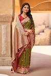 Buy_Naintara Bajaj_Olive Green Brocade, Silk Zari, Peacock Pattern Saree With Sleeveless Blouse_at_Aza_Fashions