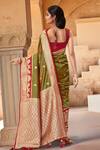 Shop_Naintara Bajaj_Olive Green Brocade, Silk Zari, Peacock Pattern Saree With Sleeveless Blouse_at_Aza_Fashions