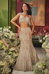 Isa By Dolly Wahal_Rose Gold Net Sequins, Crystals, Embroidery, Tassels Zara Work Lehenga Set _at_Aza_Fashions