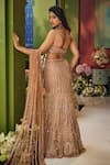 Shop_Isa By Dolly Wahal_Gold Net Embroidery, Sequins, Zari Sweetheart Geometric Fishcut Lehenga Set _at_Aza_Fashions