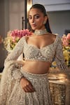 Isa By Dolly Wahal_Ivory Net Sequins, Crystals, Pearls, Embroidery, Ombre Gold Bridal Lehenga Set _at_Aza_Fashions
