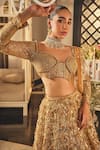 Isa By Dolly Wahal_Gold Net Sequins, Crystals, Beads, Embroidery Embellished Bridal Lehenga Set _Online_at_Aza_Fashions